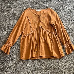 burnt orange peasant shirt. so nice for fall. has that nice billowy shape.